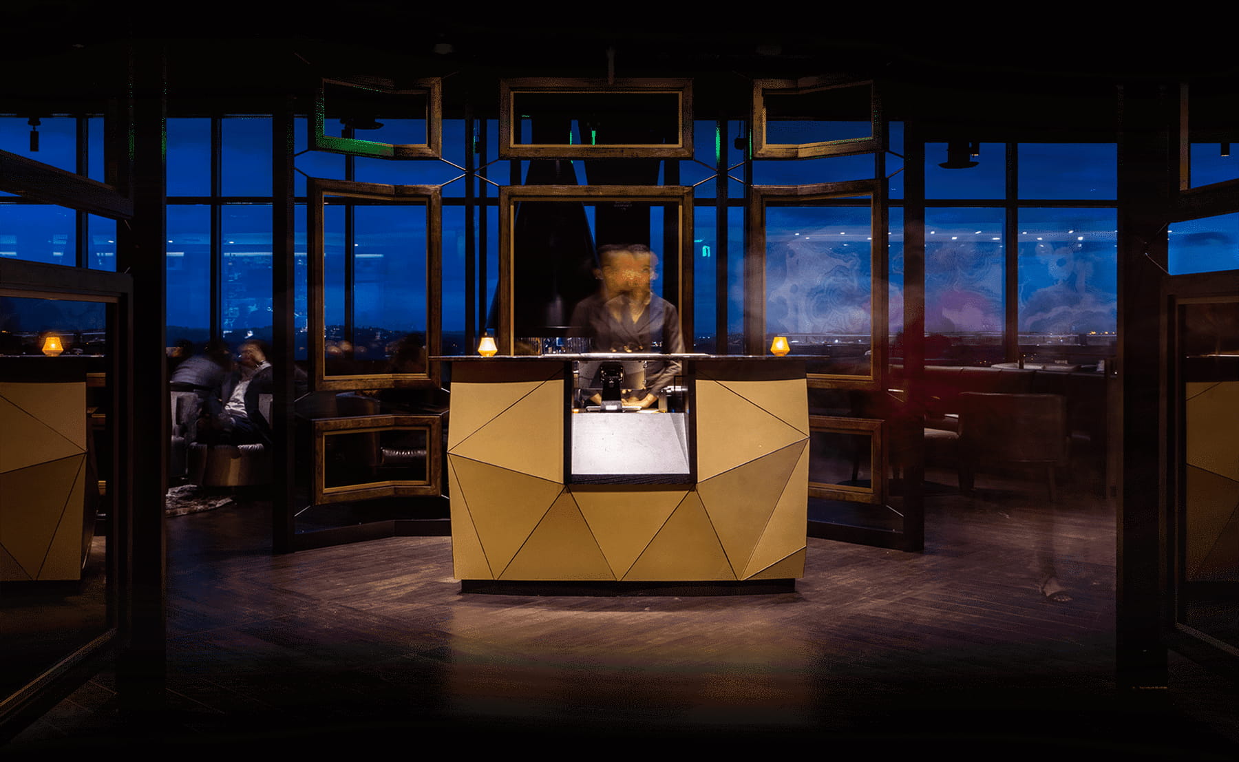 Bellevue restaurant front desk with attentive staff and view of city