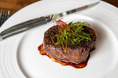 Wagyu steak with scallion, miso demi-glace, and black garlic butter