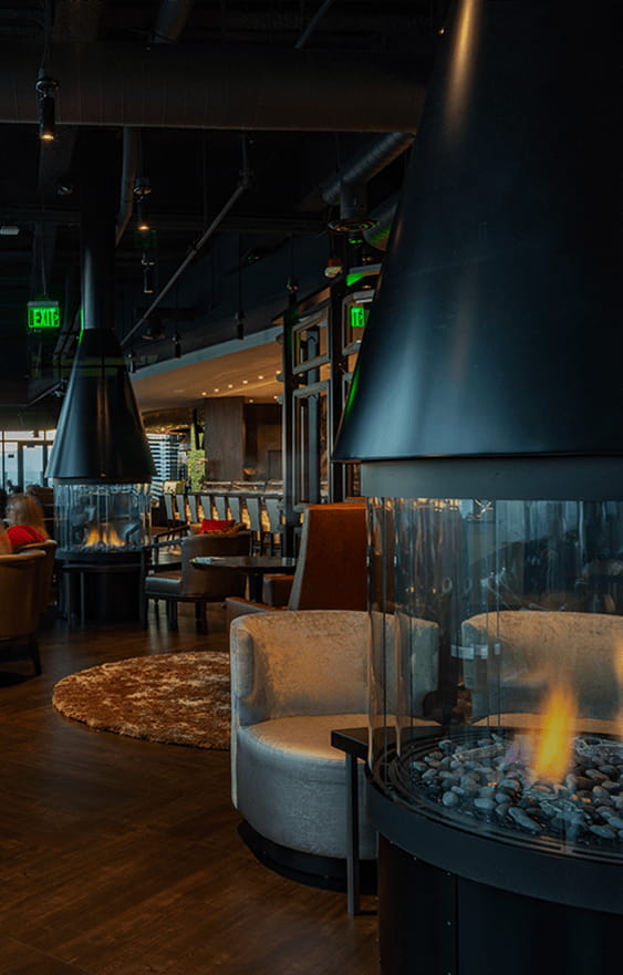 Bellevue restaurant lounge with fireplaces and comfortable chairs for happy hour