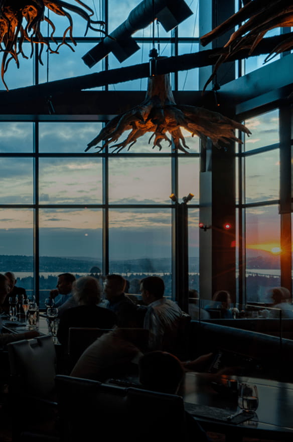 Bellevue fine dining restaurant with patrons enjoying wine at spacious tables