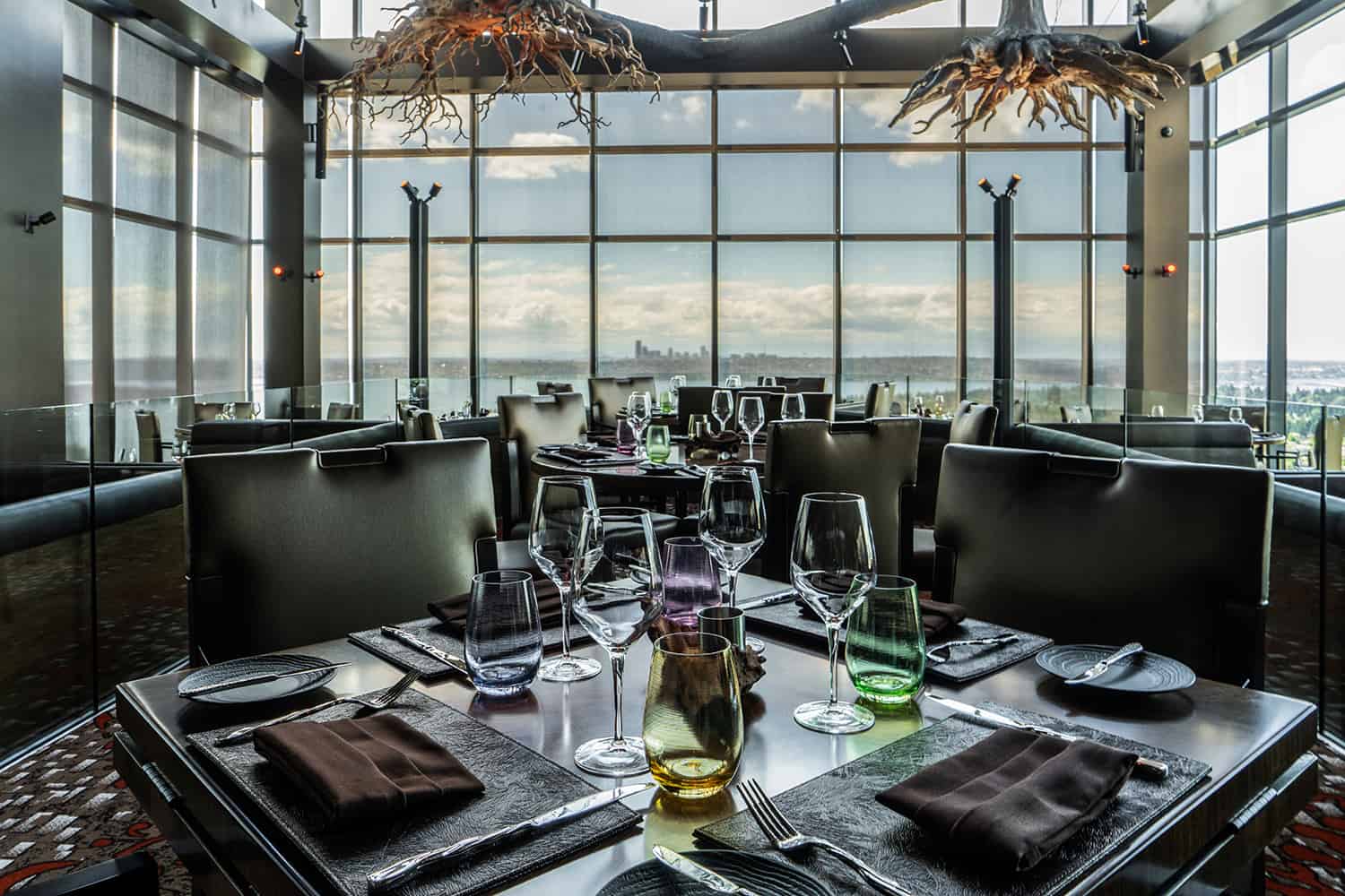 Bellevue fine dining restaurant with view of water and tables set with wine glasses