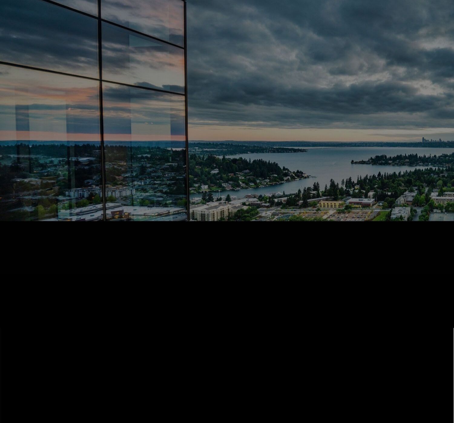 Bellevue suburbs with lake and trees from restaurant on 31st floor of downtown Bellevue building