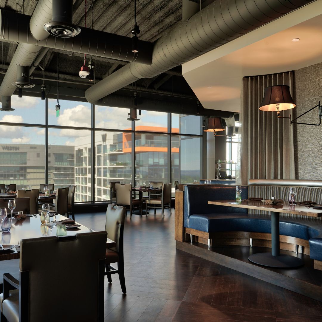 Bellevue steakhouse with spacious seating and window overlooking downtown Bellevue